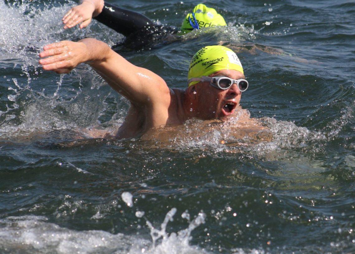 A swimming in an open water race looking forward
