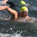 A swimming in an open water race looking forward