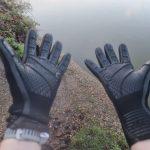 Two hands with neoprene gloves on