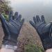 Two hands with neoprene gloves on
