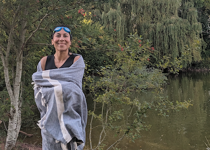 Abi Whyte standing by a river